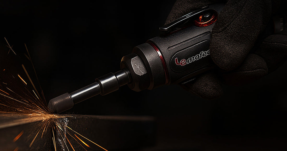 Close-up of a hand using a Le Lematec pneumatic die grinder to grind metal, creating bright orange sparks.