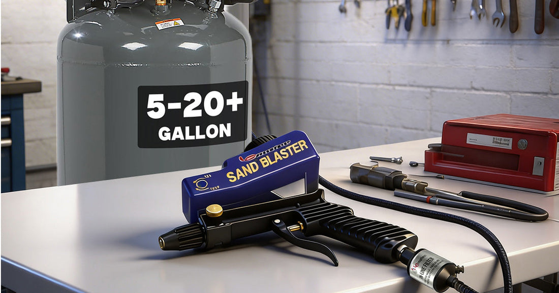 Le-Matec sand blaster tool placed on a workbench next to a 5-20 gallon air compressor tank for sandblasting.