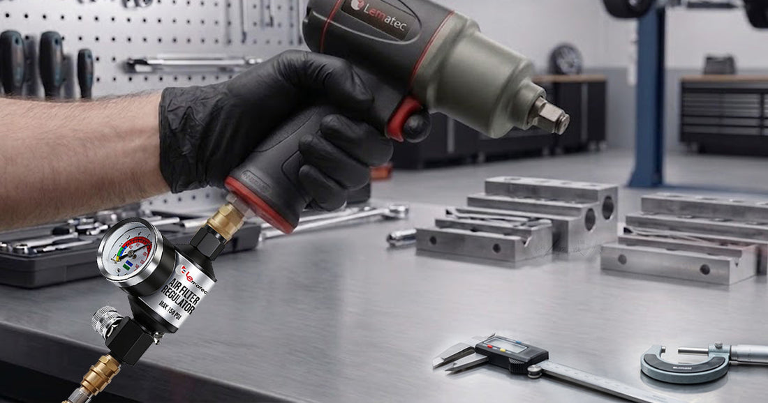 Hand holding a pneumatic impact wrench with an attached air filter regulator in a professional automotive workshop.