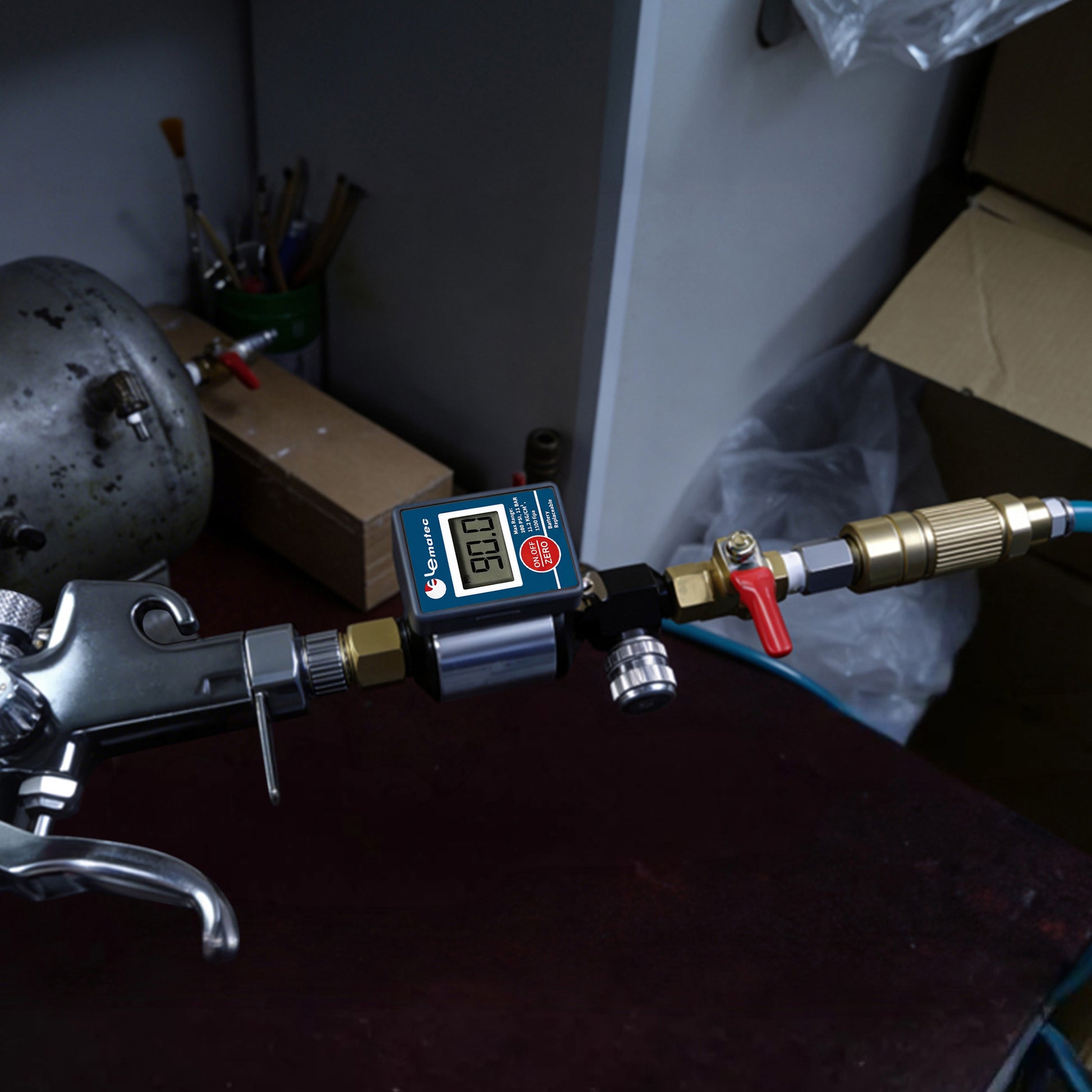 AI303-R2 connected inline between a blue air hose and a spray gun on a workshop bench