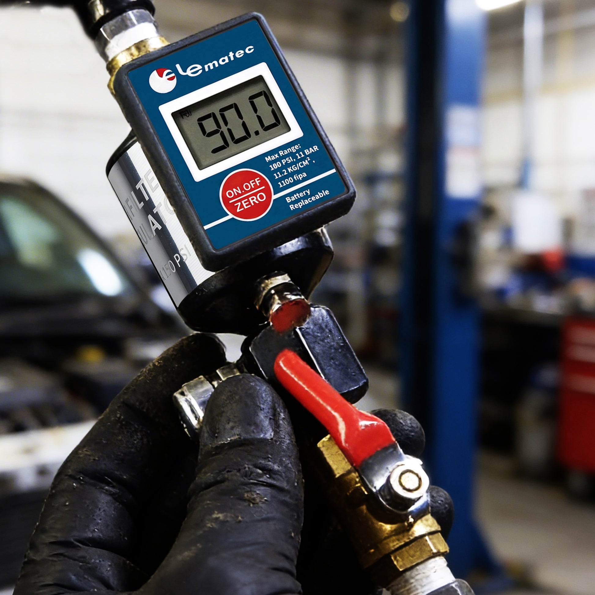 AI303-R2 air filter regulator with red ball valve lever being operated by a gloved technician in an auto shop